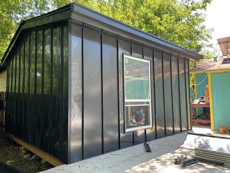 Black standing seam metal wall panels for Metal Roof Installation in Holladay